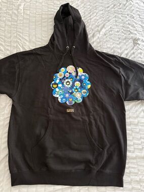 ComplexCon Black Hoodie with Blue Floral Smiley Graphic